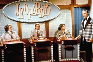Art Fleming and contestants on the nighttime syndicated Jeopardy, 1974
